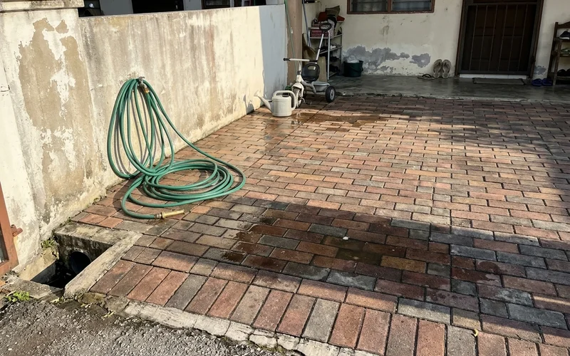 Cleaned patio and driveway drying in the afternoon sun