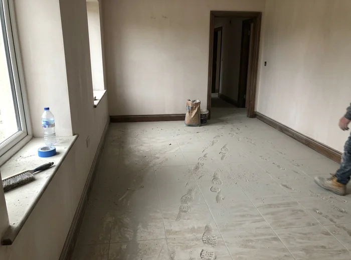 Gypsum dust covering surfaces before post-renovation cleaning