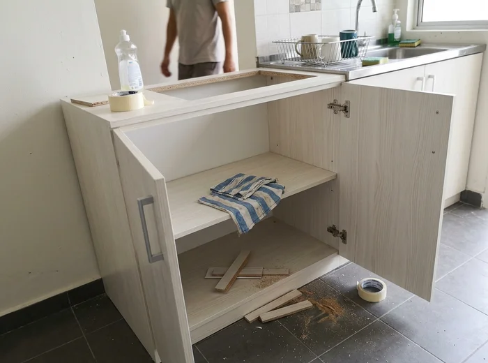Cabinet interiors cleaned of construction debris